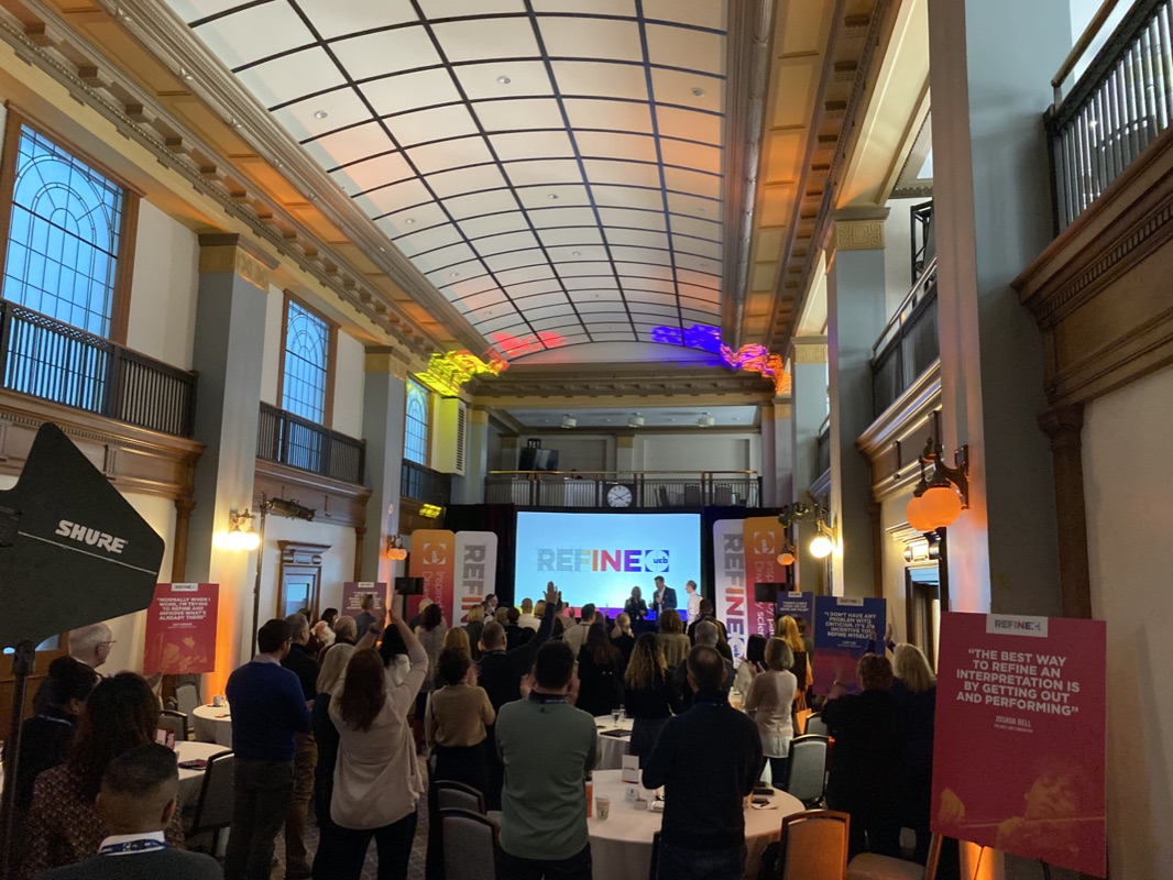 Refine conference in heritage venue with colorful lighting