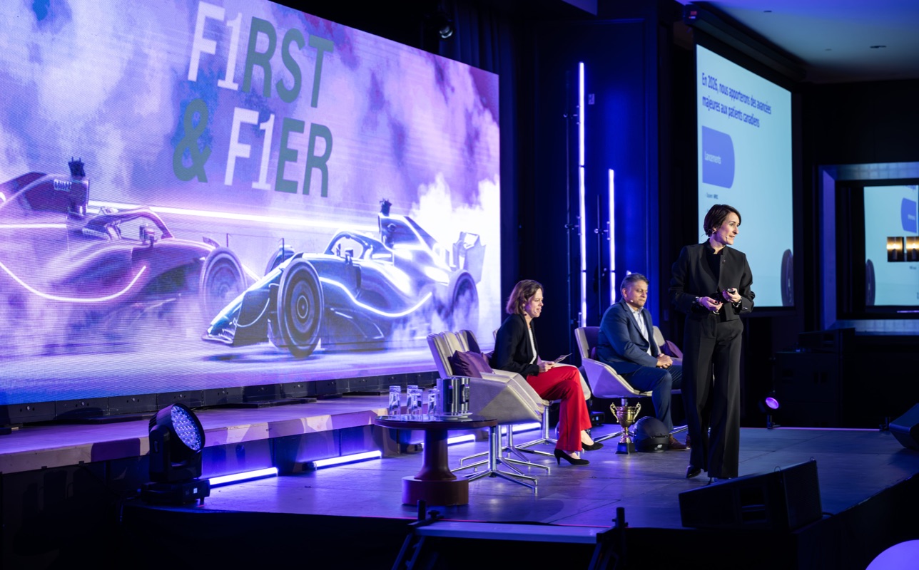 Panel discussion on stage with wide audience view