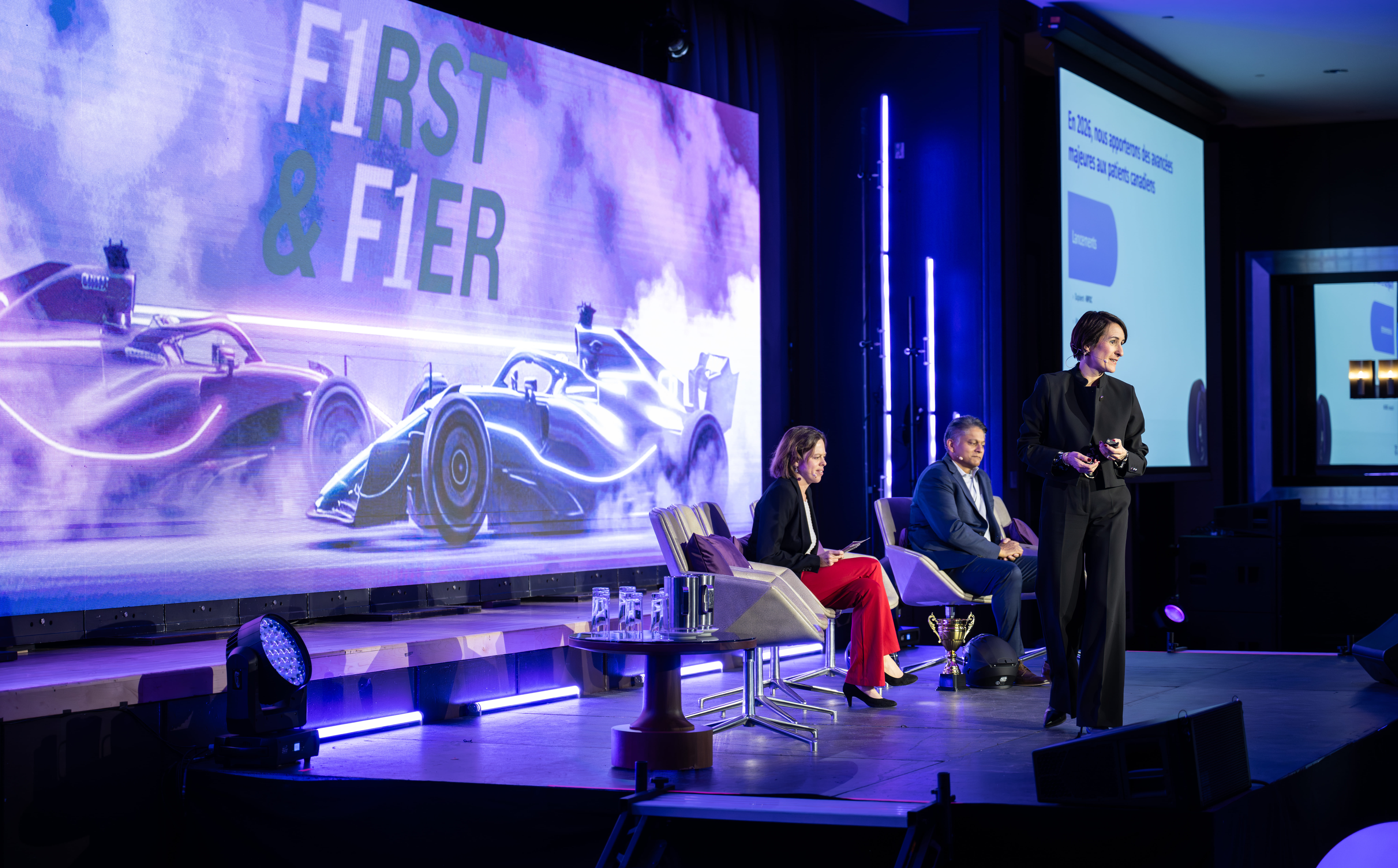 Panel discussion on stage with wide audience view