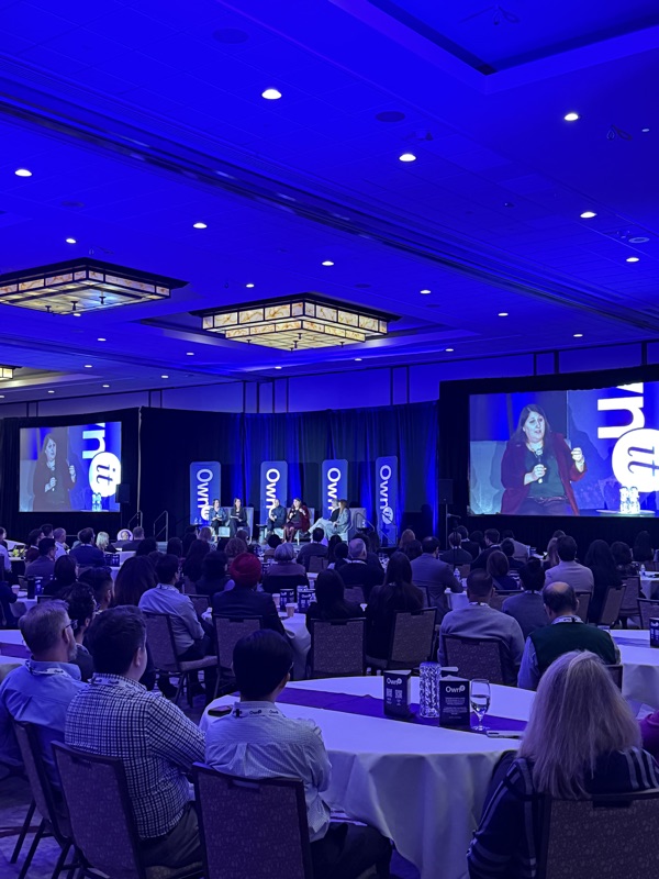 Corporate conference with IMAG screens and blue lighting