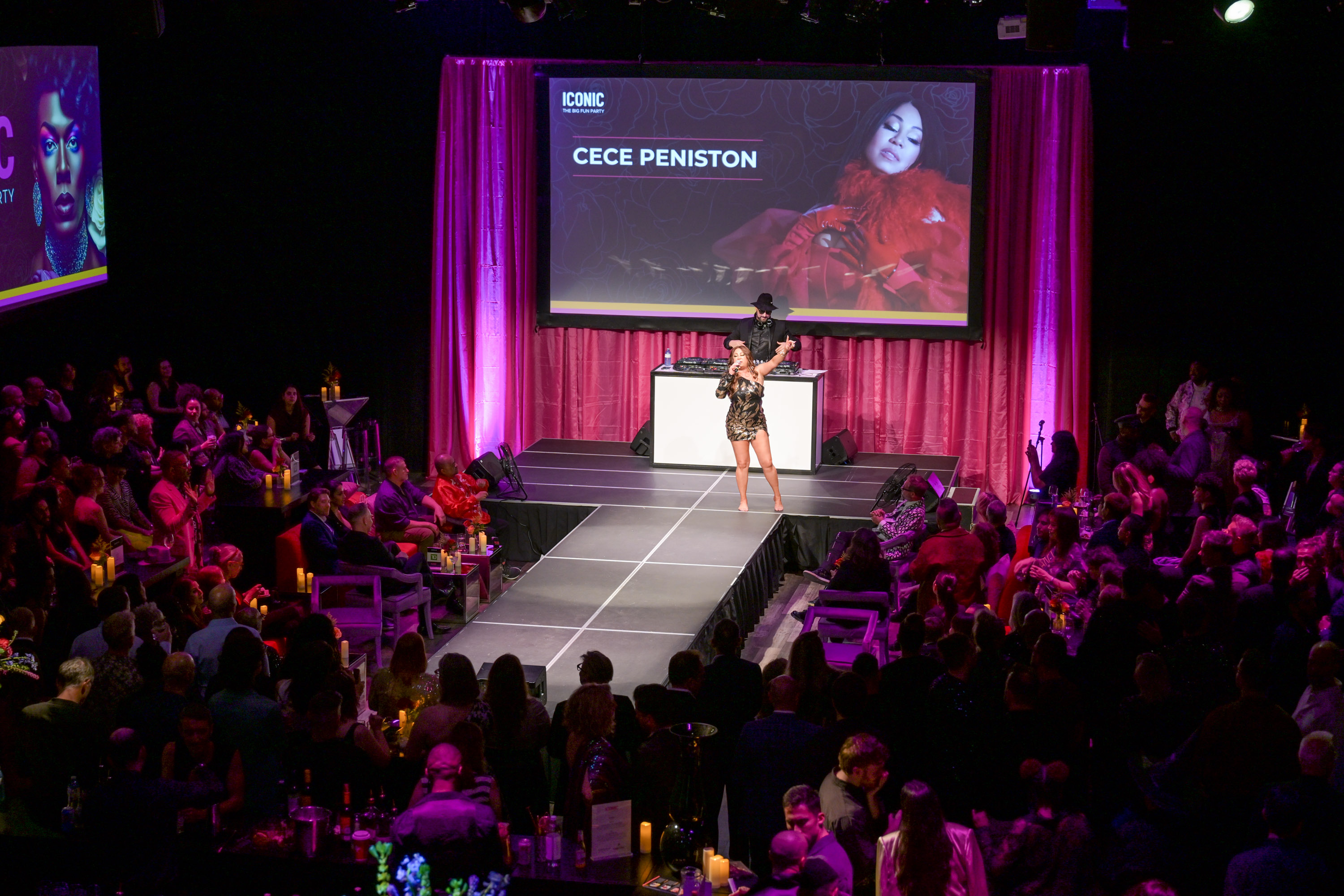 CeCe Peniston performing at ICONIC event with pink lighting